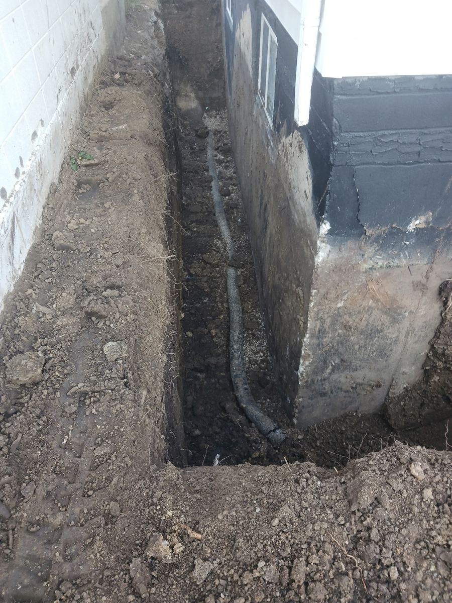 Trench run for drain tile routing