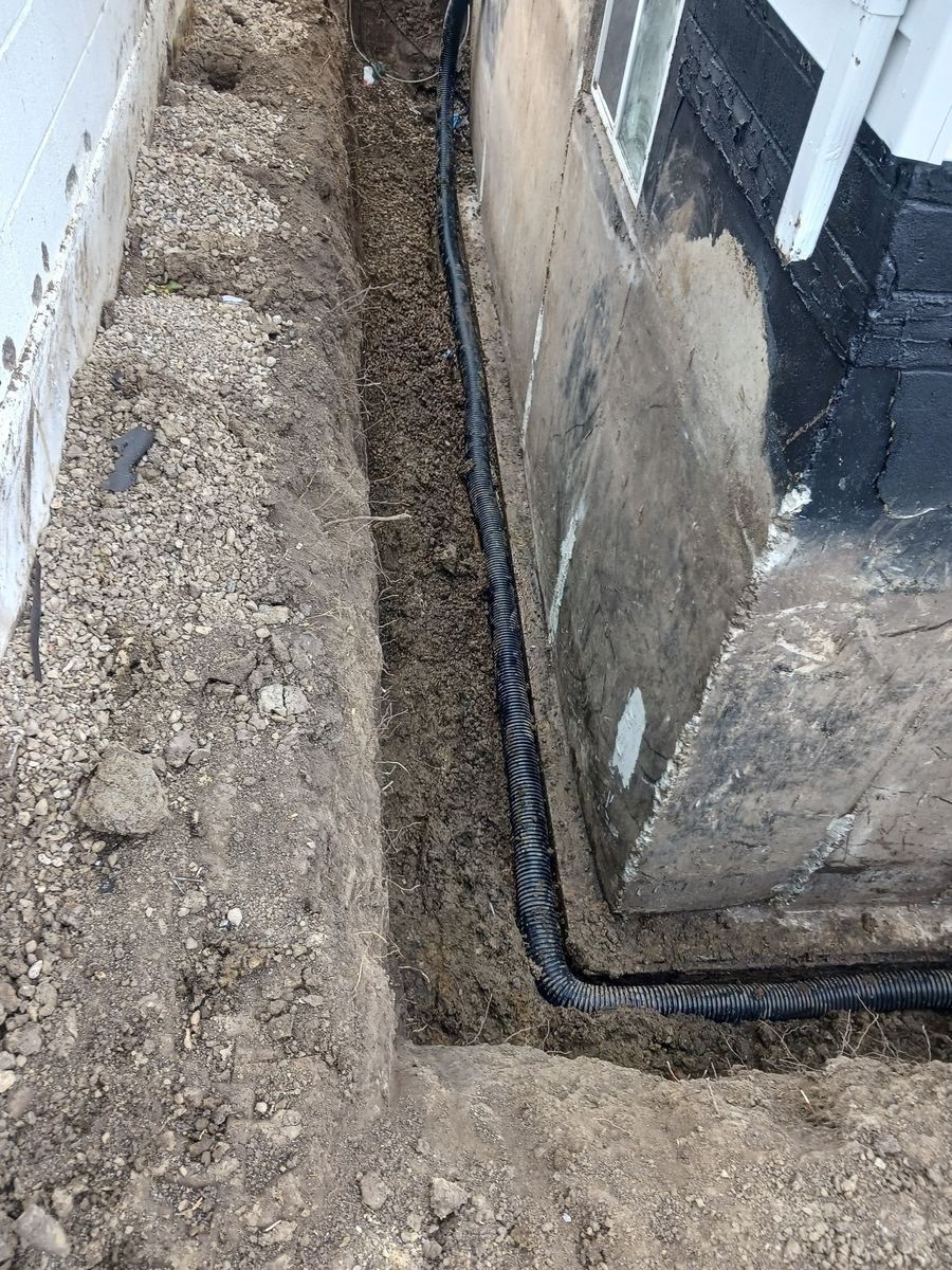 Weeping tile run at foundation corner